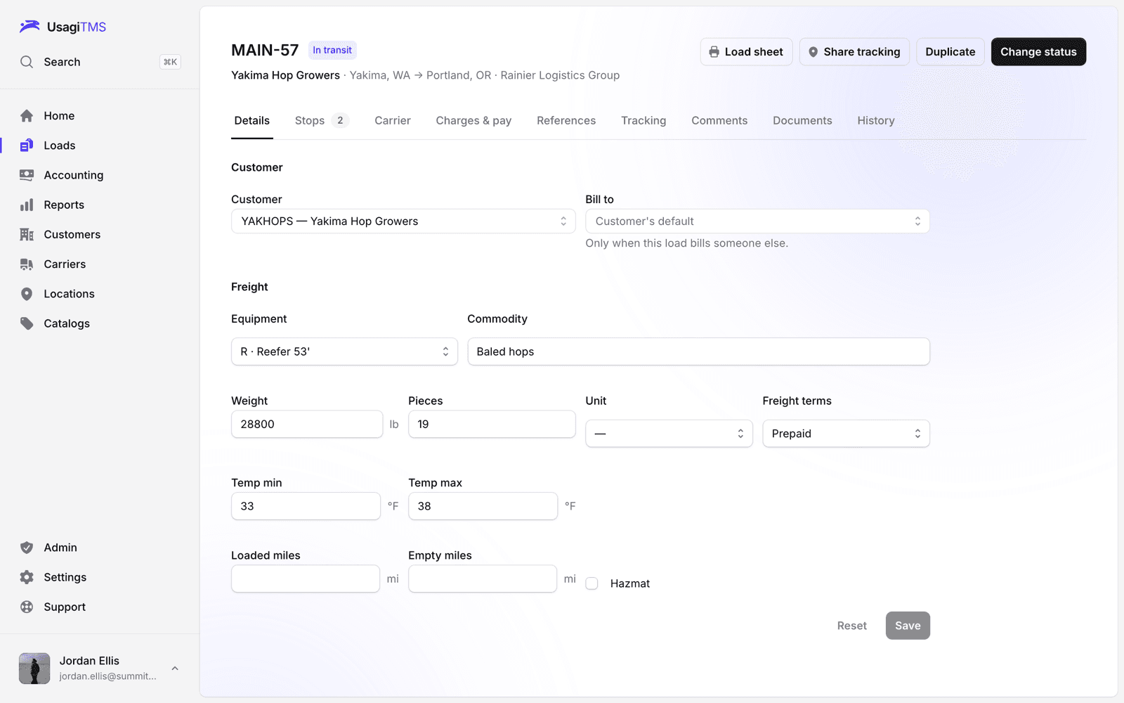 A load in transit, with tabs for stops, carrier, charges and pay, tracking, documents and history